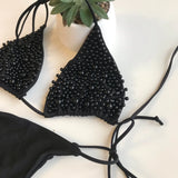 Gyöngyberakásos, megkötős brazil tangás fekete bikini szett